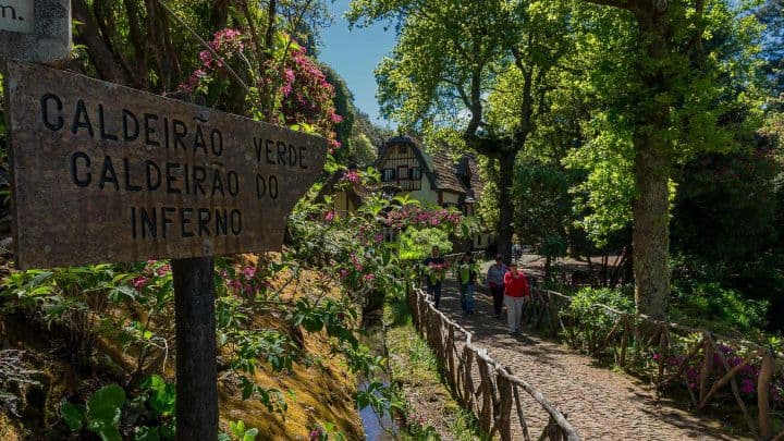 Levada path and traditional Queimadas house on PR9 Levada do Caldeirão Verde, Madeira